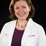 Dr. Audrey Eliott - Dentist, smiling at the camera