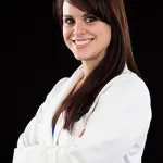 Dr. Lauren Johnson - Dentist, smiling at the camera