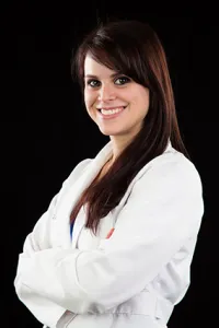 Dr. Lauren Johnson - Dentist, smiling at the camera