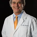 Dr. Ronald Brenner - Dentist, smiling at the camera