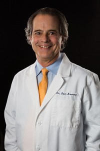 Dr. Ronald Brenner - Dentist, smiling at the camera